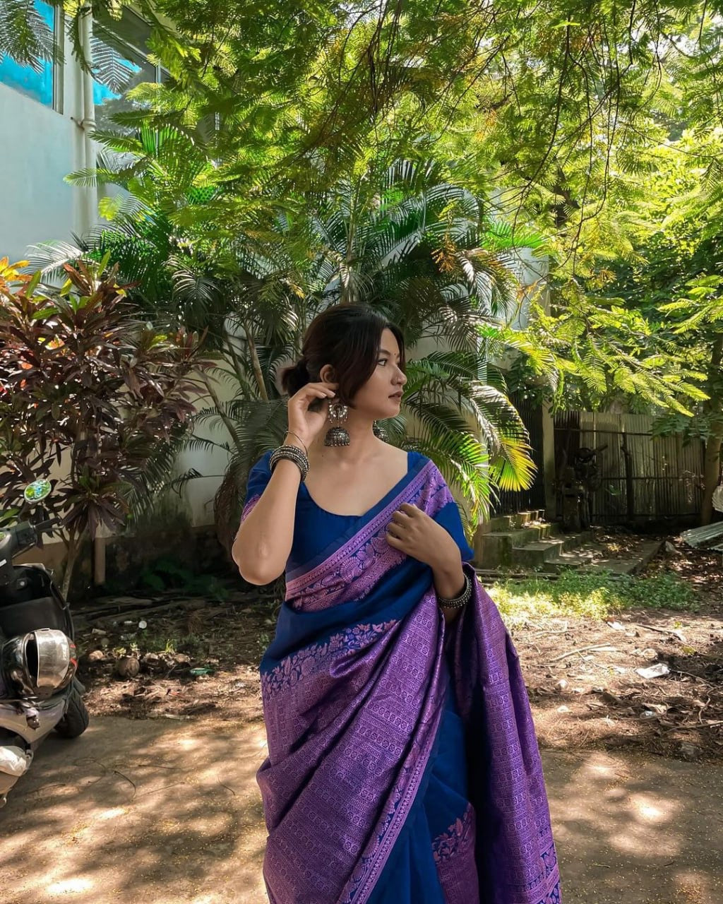 Royal Blue and Purple Banarasi Silk Saree with Intricate Zari Border.